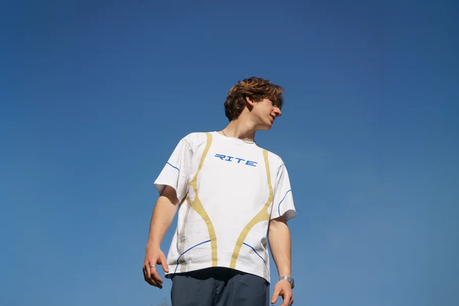 The Drop 1 tee against a clear blue sky